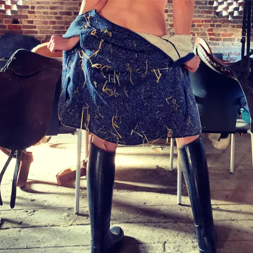Rubber riding boots and not much else