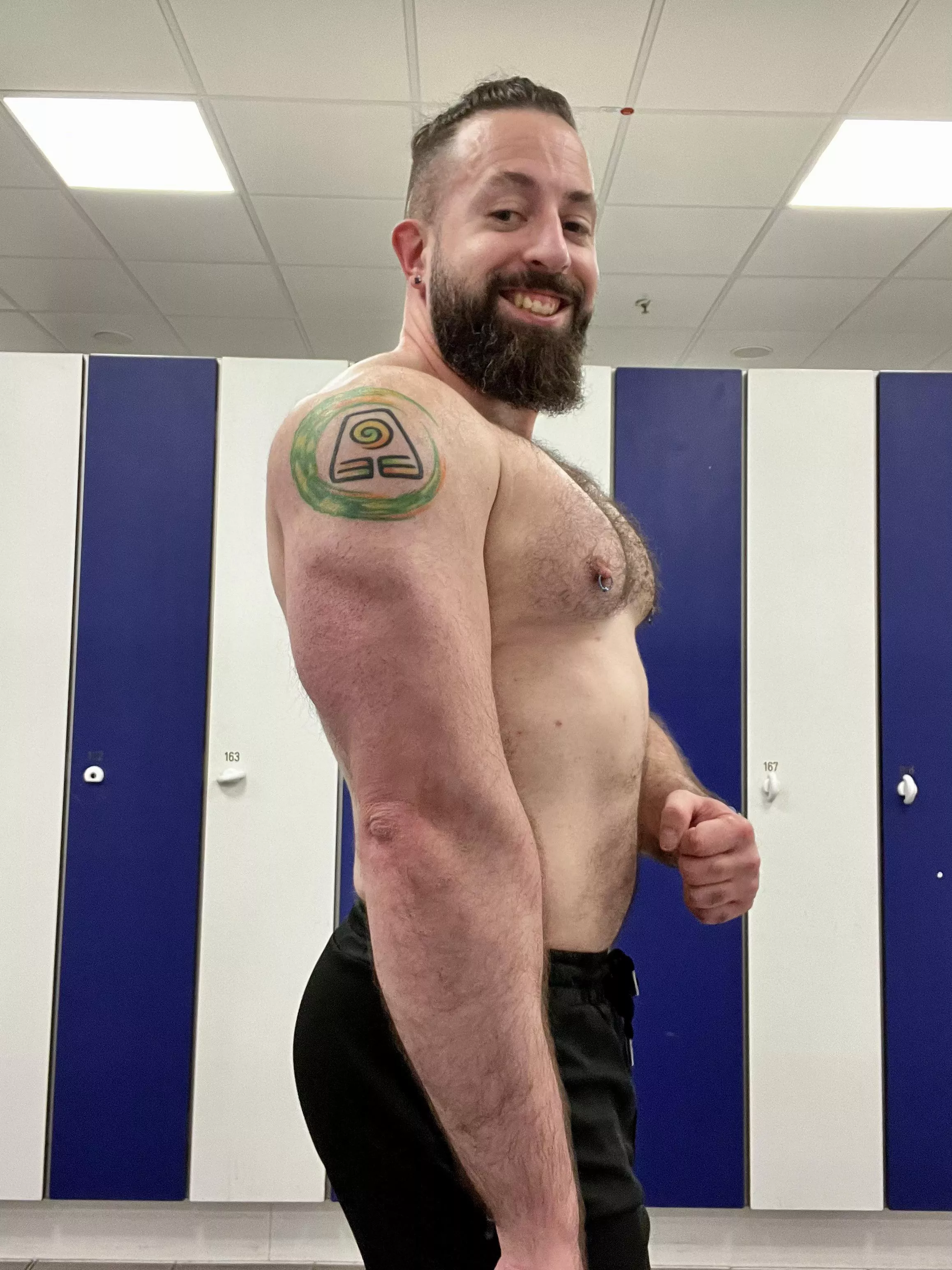 Showing off the gains and tattoo