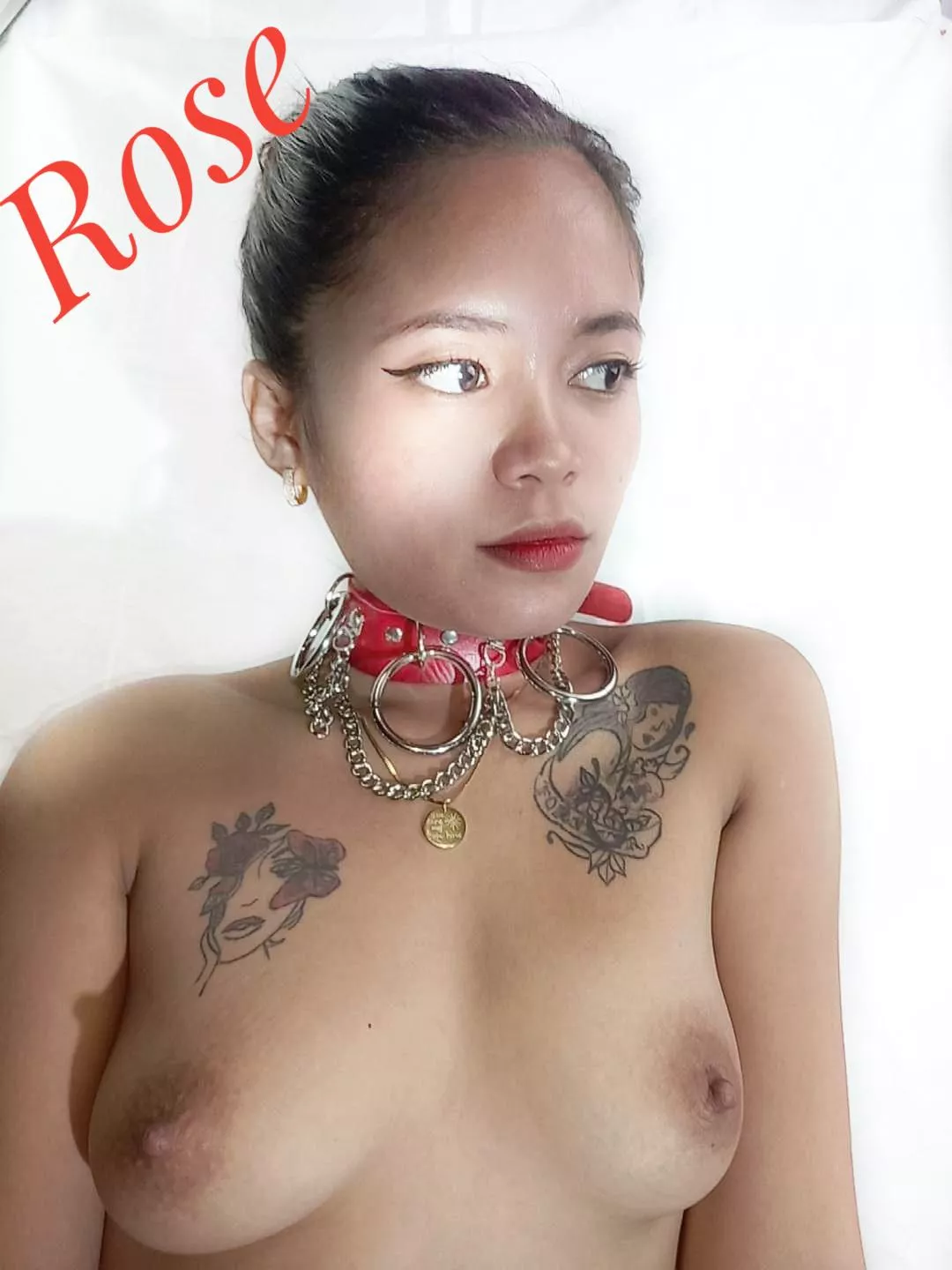 Rose is twenty one. Tattoo'd and collared Filipina. enjoy being a sub.