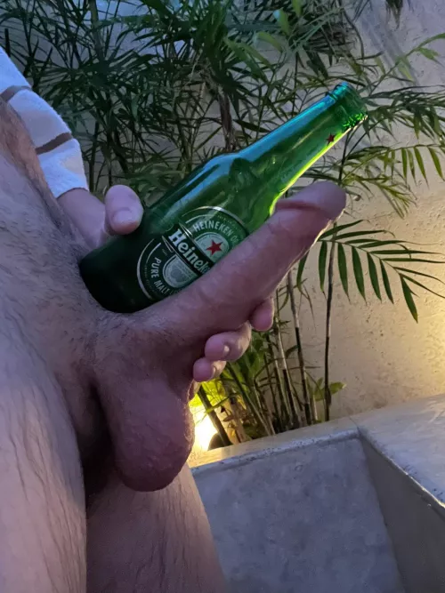 Beside a beer bottle