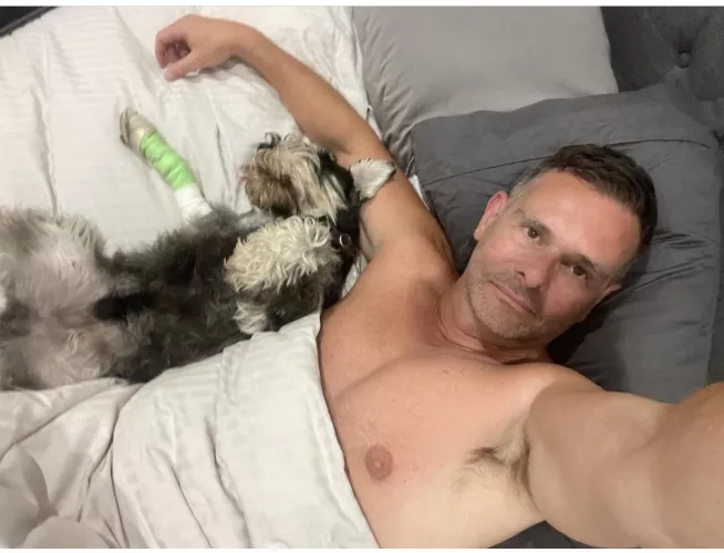 My dog just had surgery to remove a grass seed. Now we’re resting together.