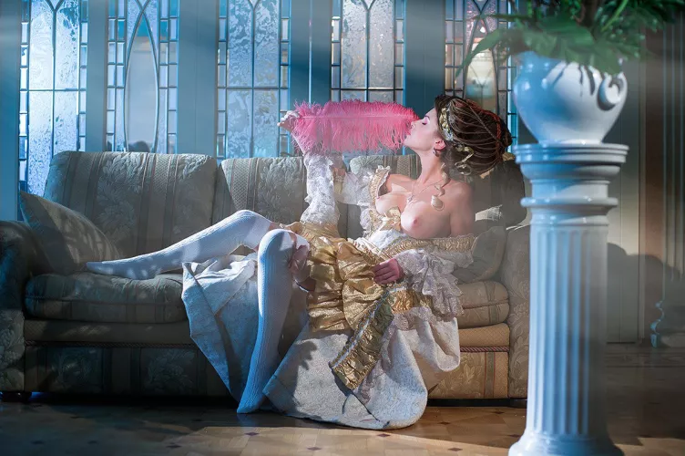 Fanning herself with a feather