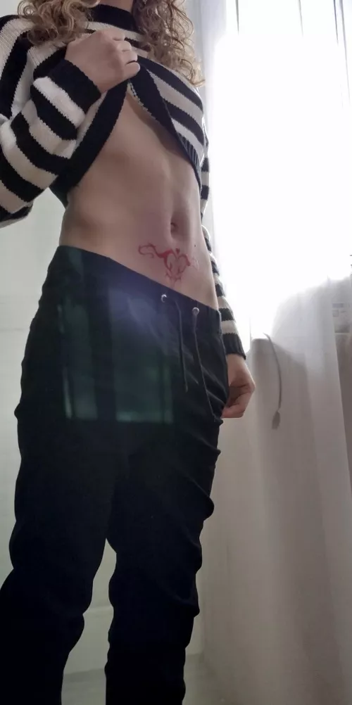 Tum with tattoo