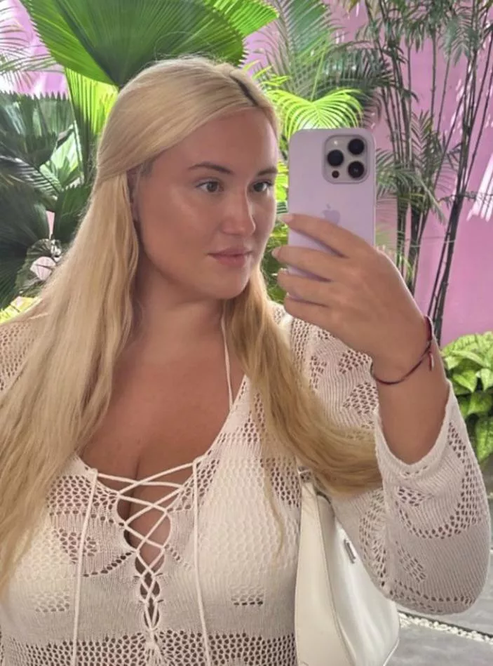 Stretching her beach cover