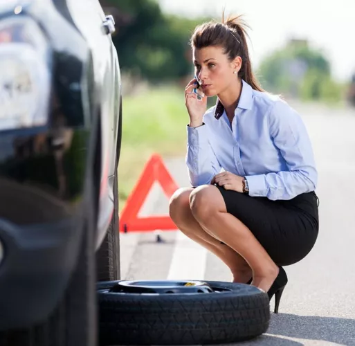 Car trouble brunette with ponytail
