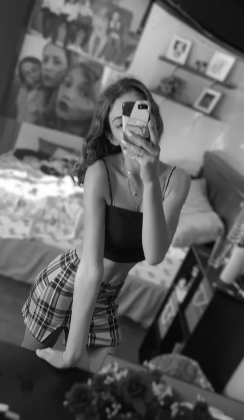 Tight girl in a crop top and skirt