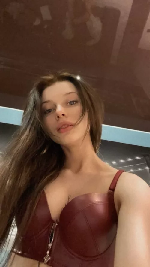 Reach over to unzip my bra