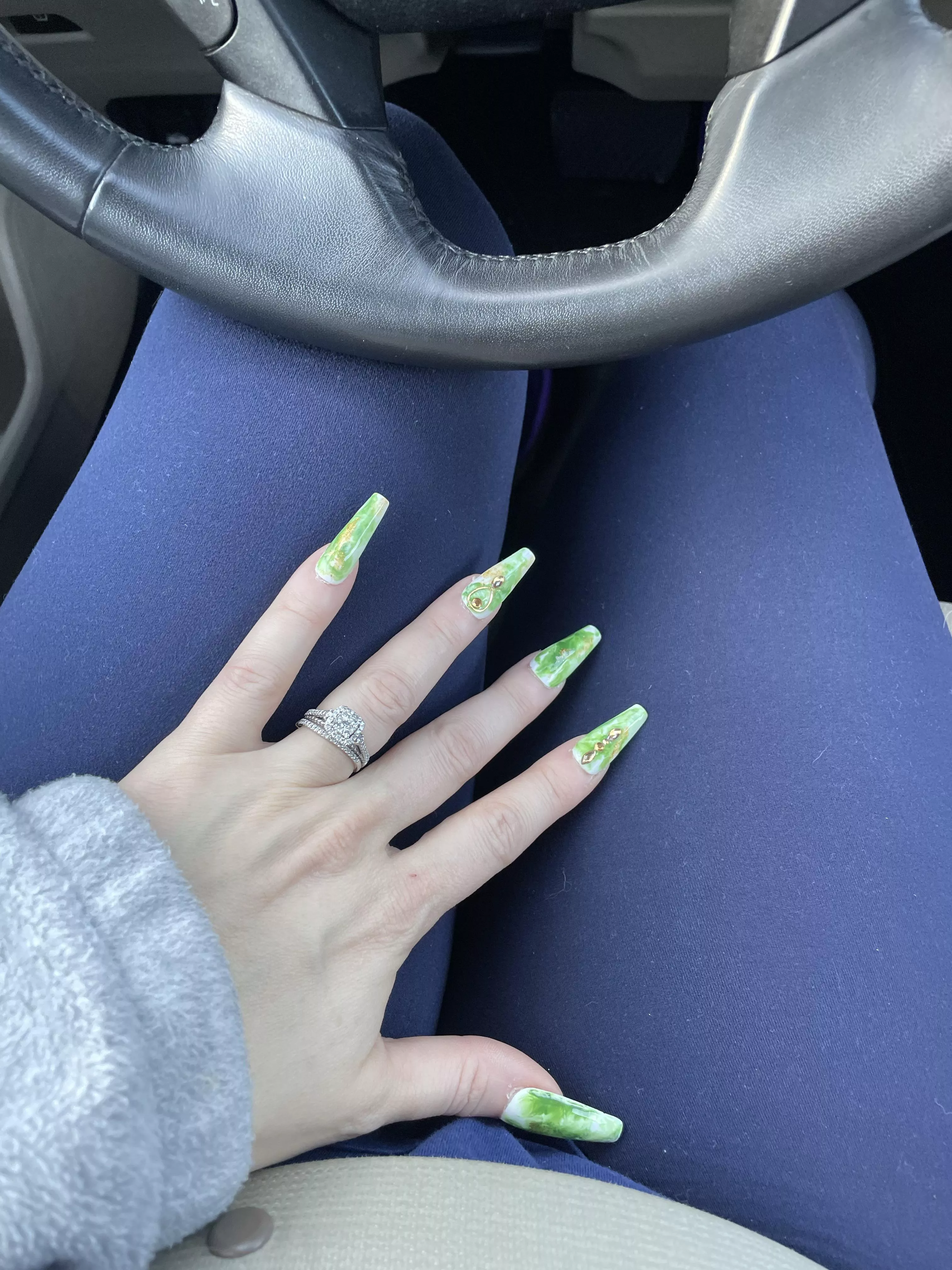 Jade nails on navy leggings