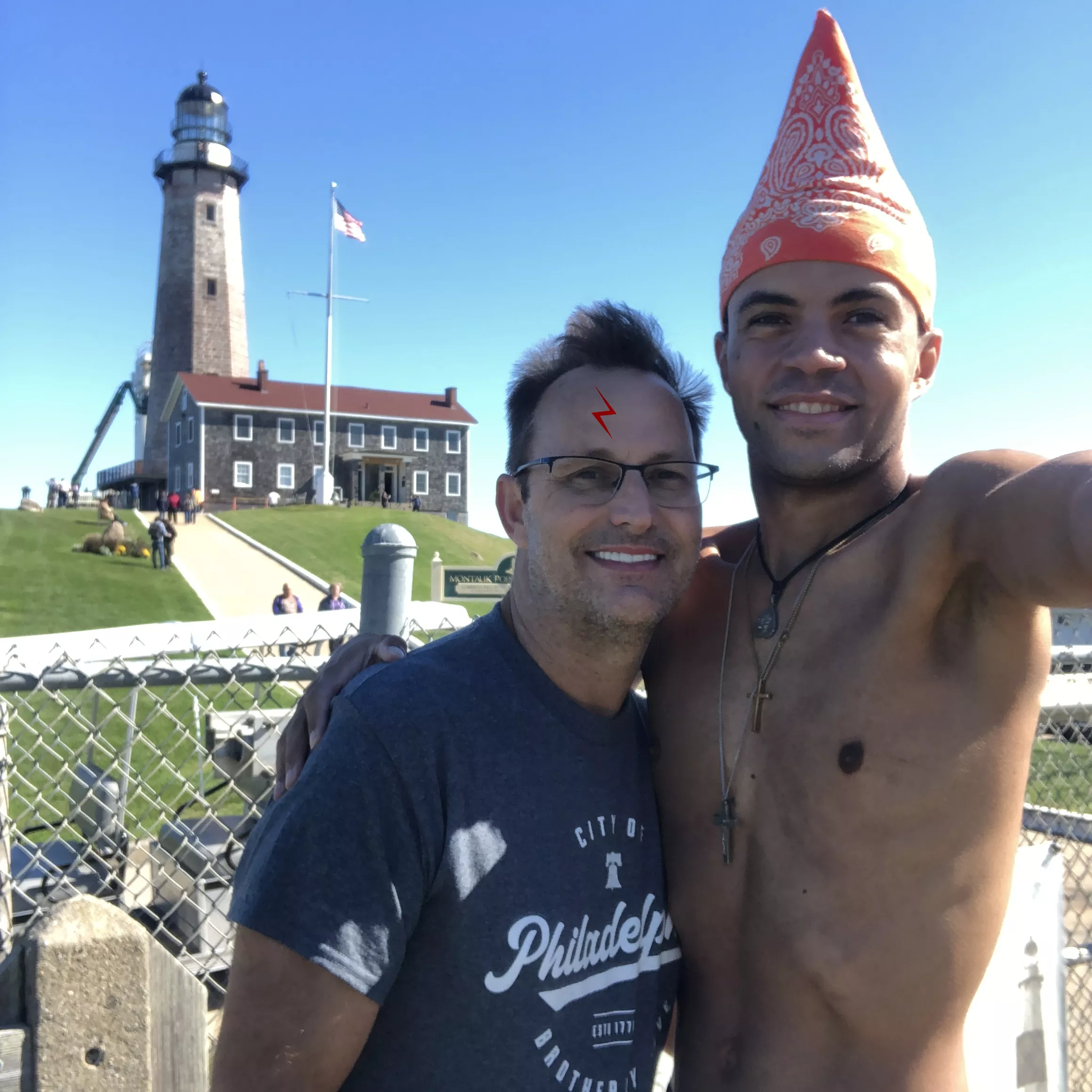 me/Joe Winko (Shirtless guy in the Orange Pointy Bandana) with HARRY POTTER at the Montauk Point Lighthouse in Long Island New York last fall. (EVERY SINGLE REDDIT SUB I HAVE POSTED THIS PIC ON HAS BEEN TAKING IT DOWN AND IT PISSES ME OFF!) 😠