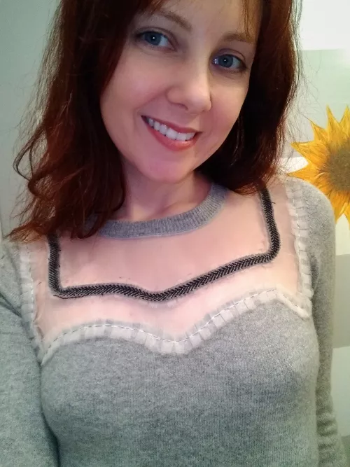 I love how my sweater frames my small chest