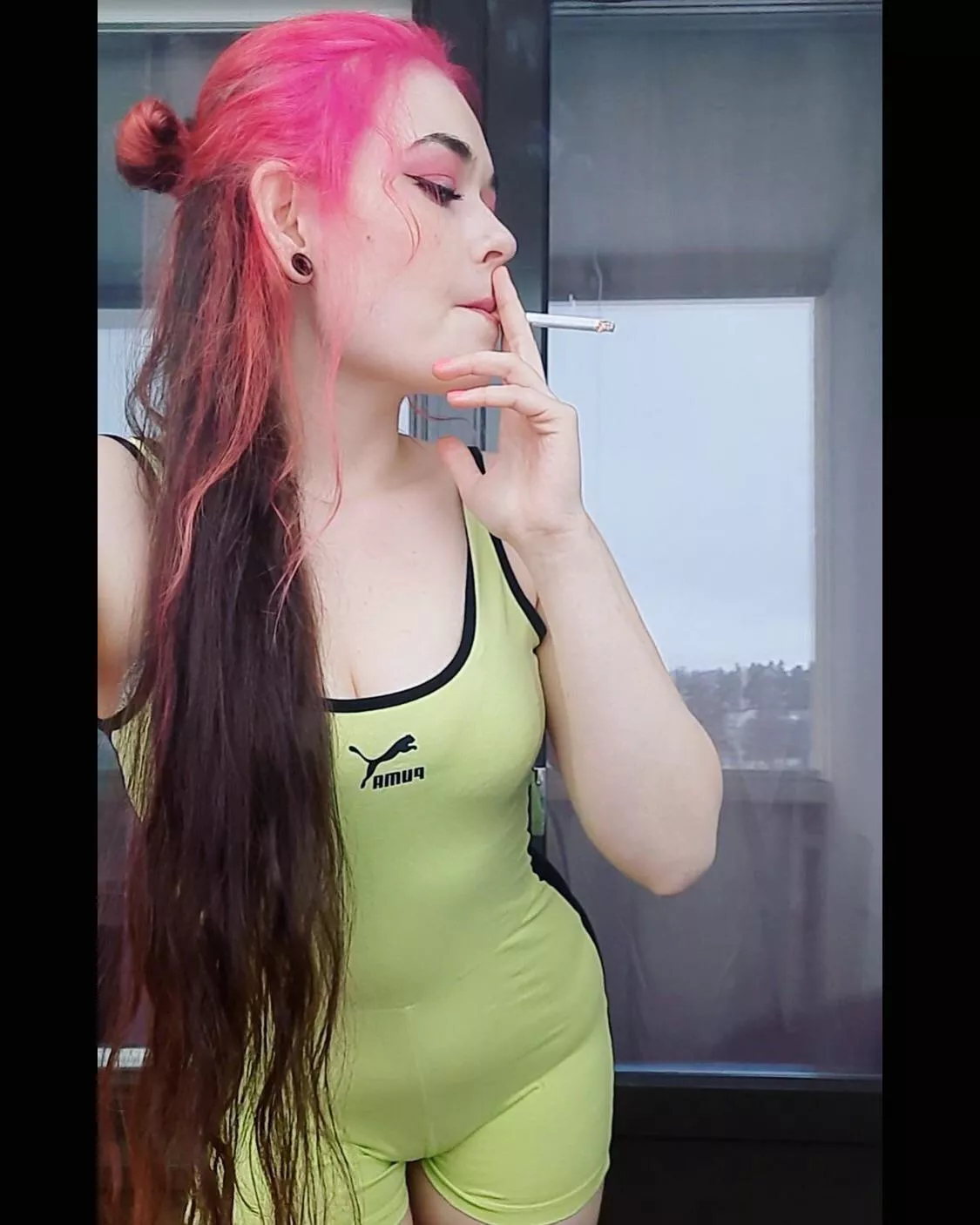 Smoking redhead in a sporty outfit🥰