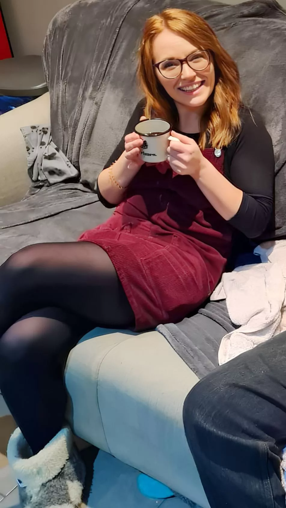 Cute smiley redhead with sexy legs