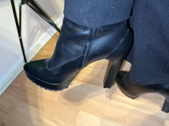 Black leather boot goofing