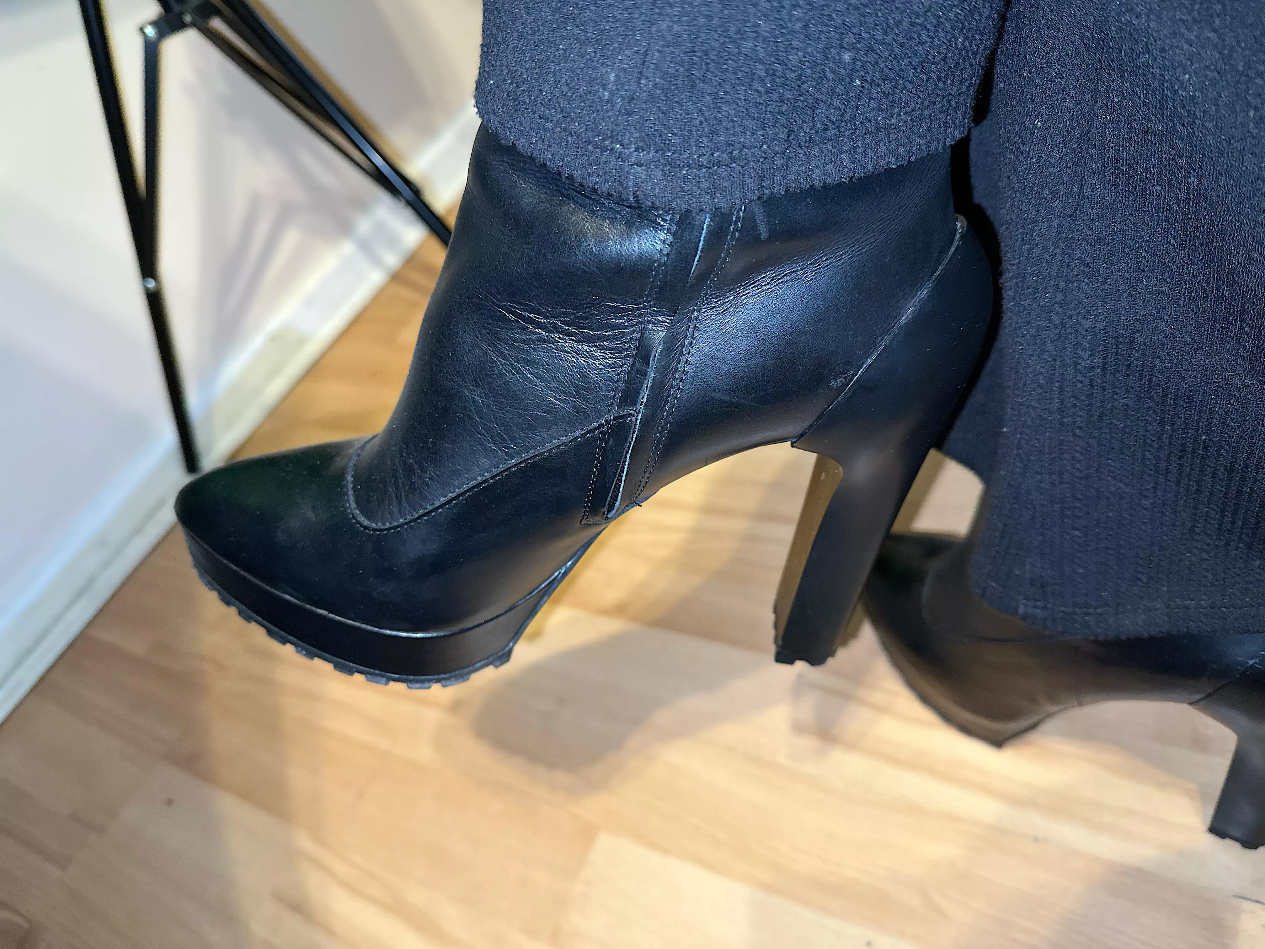 Black leather boot goofing