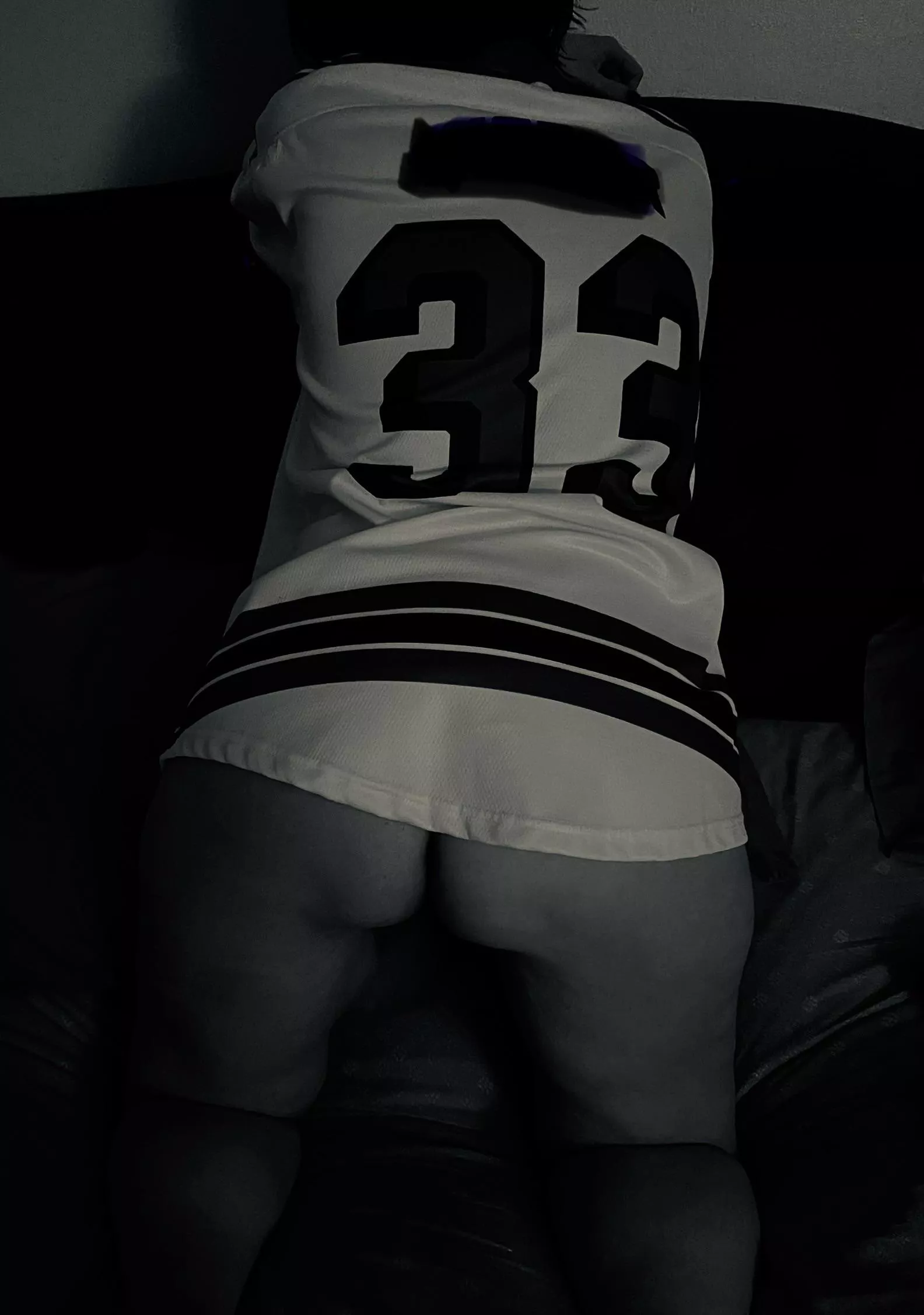 Waiting for him with his hockey jersey on.