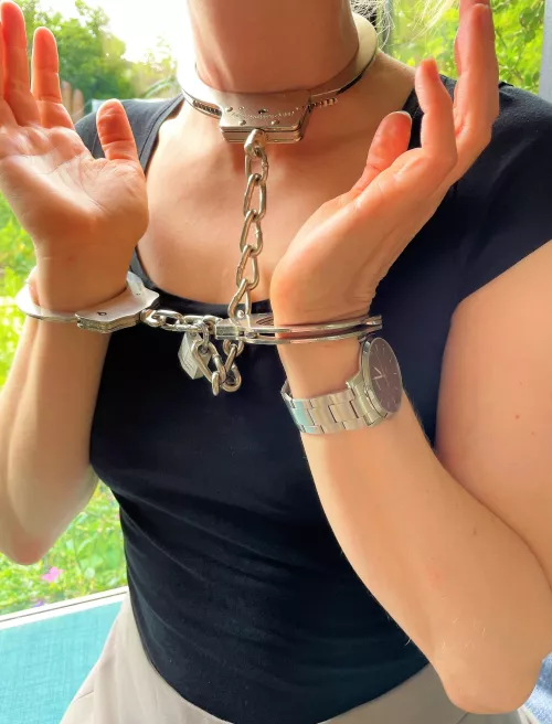 Neckcuffed and handcuffed