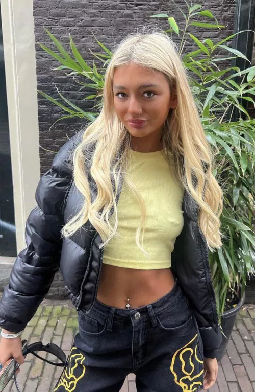 Cute blonde Jodie walks around Amsterdam showing her nipple jewellery