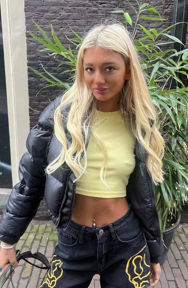 Cute blonde Jodie walks around Amsterdam showing her nipple jewellery