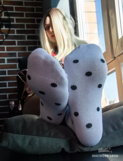 My feet relax under the spring sun in cute white socks