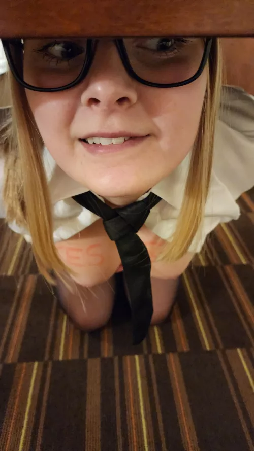 Can you read what this intern has written on her tits, sitting under your desk?