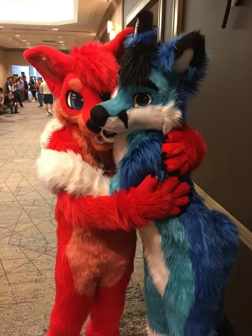 Flame and glacier foxes hugging each other at TFF 2023. Feat. @ZethinFox.