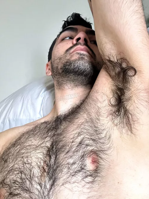 My pinkish nipples really stand out from the dark fur