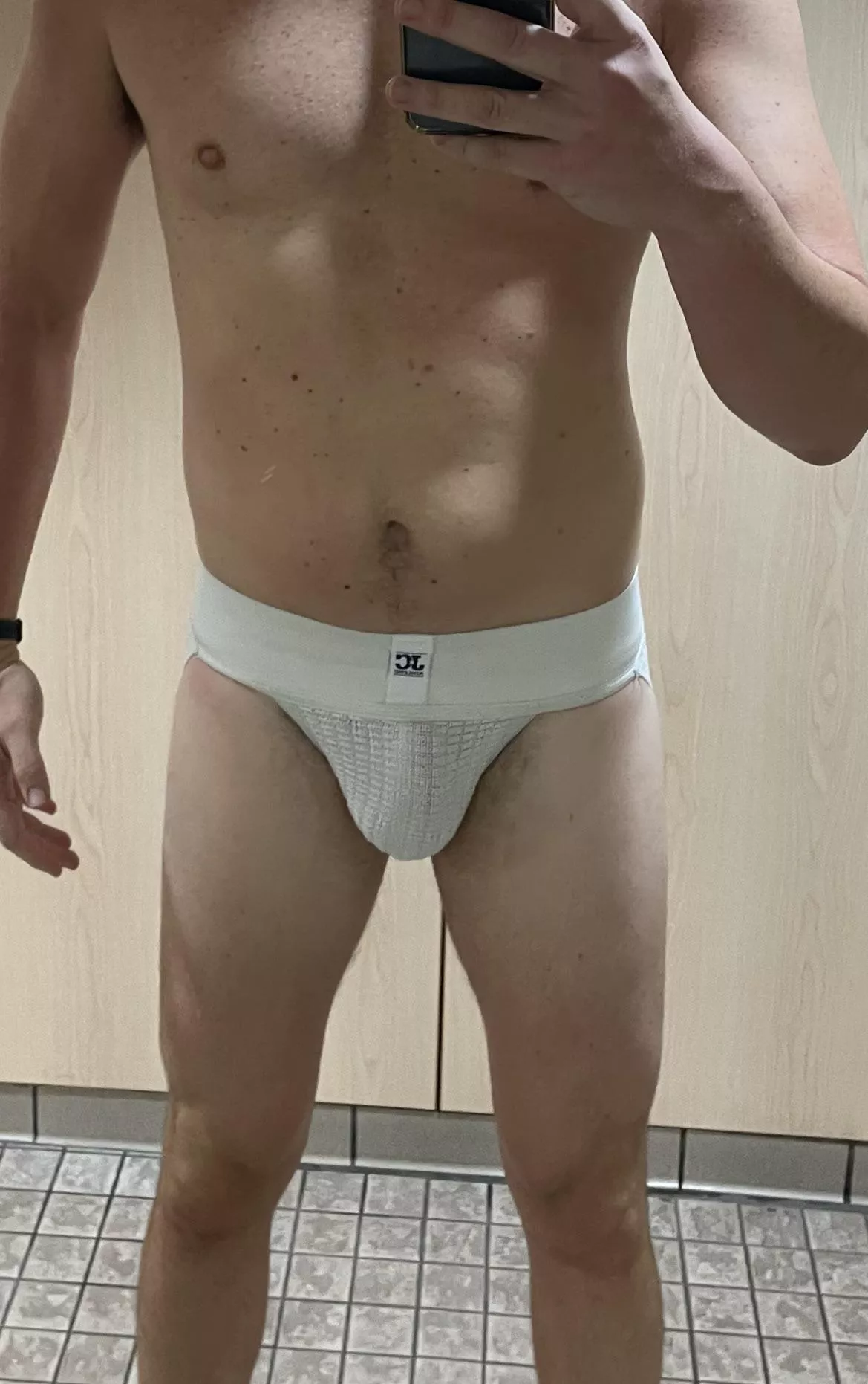Classic white, wide-band jockstrap in the locker room this morning. Walked across the locker room to take the pic.