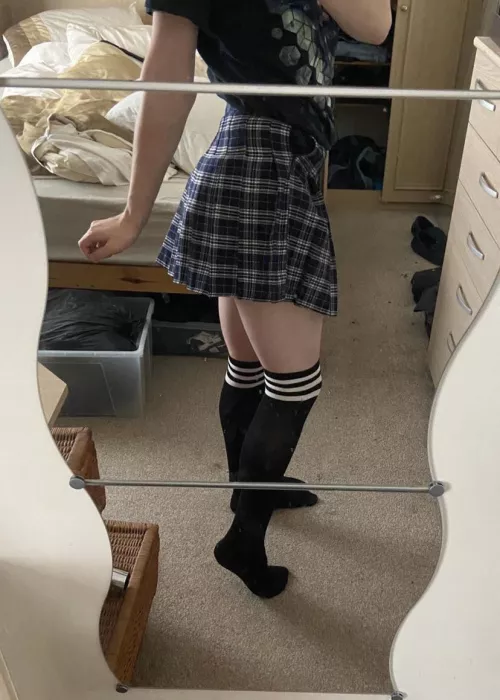 Me in my sisters skirt and thigh highs. I really look cute in these!