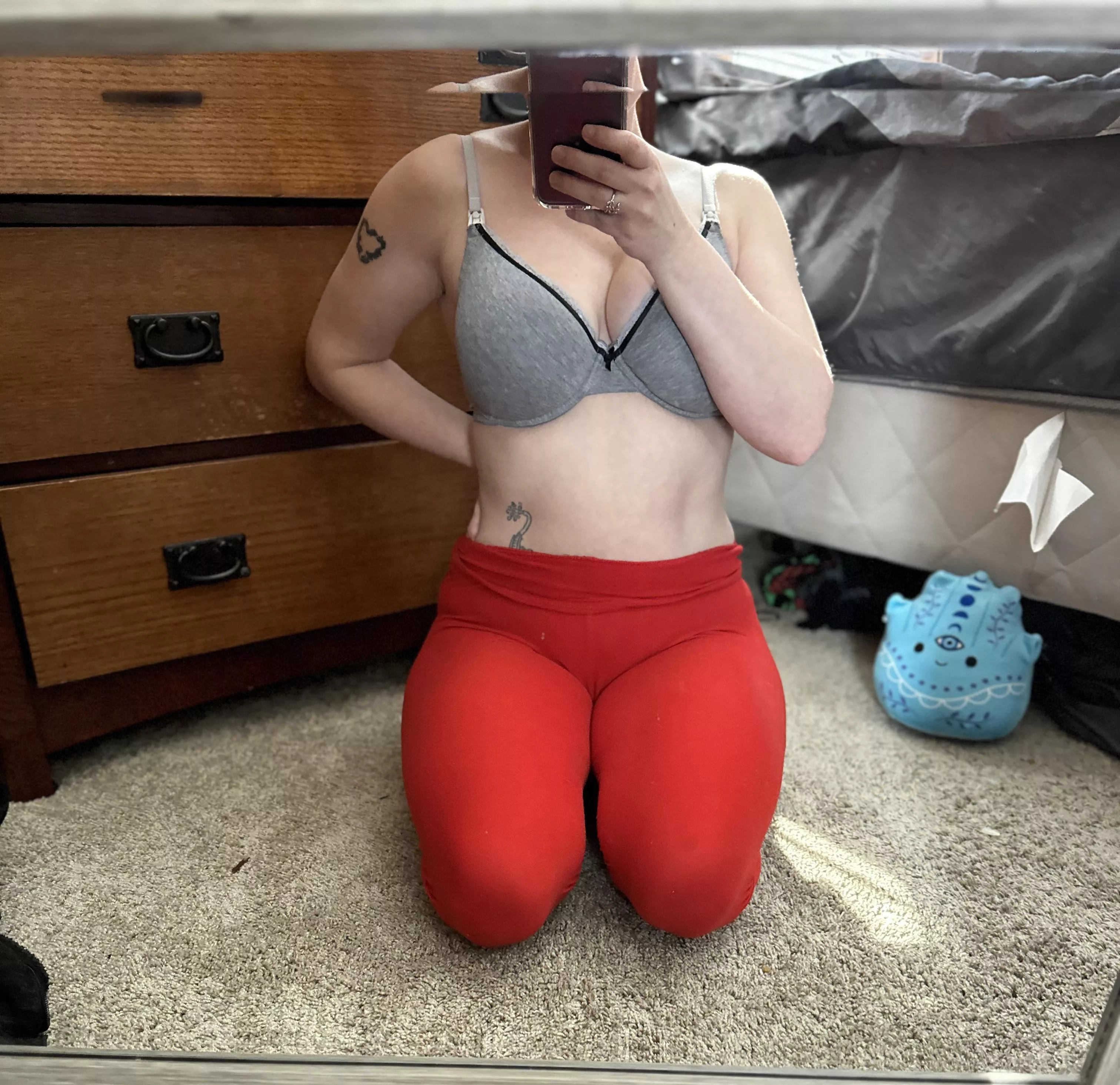 Short and thic with see through red leggings.