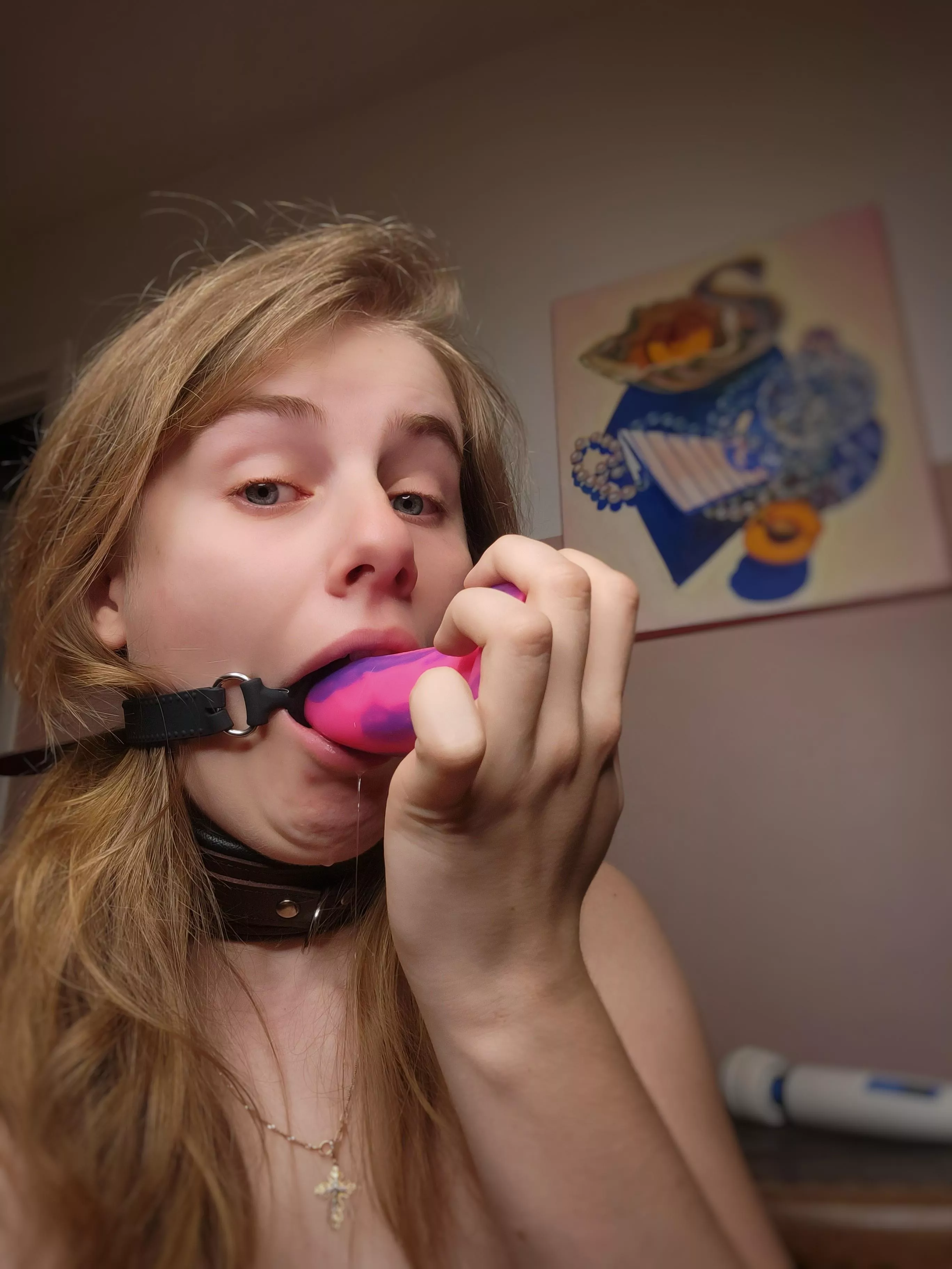 My ring gag fits my pretty pink dildo, isn't that convenient...