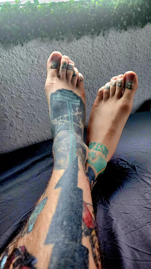 Fancy Speakeasy Hipster Bartender resting his feet before serving flaming cocktails for a Friday night