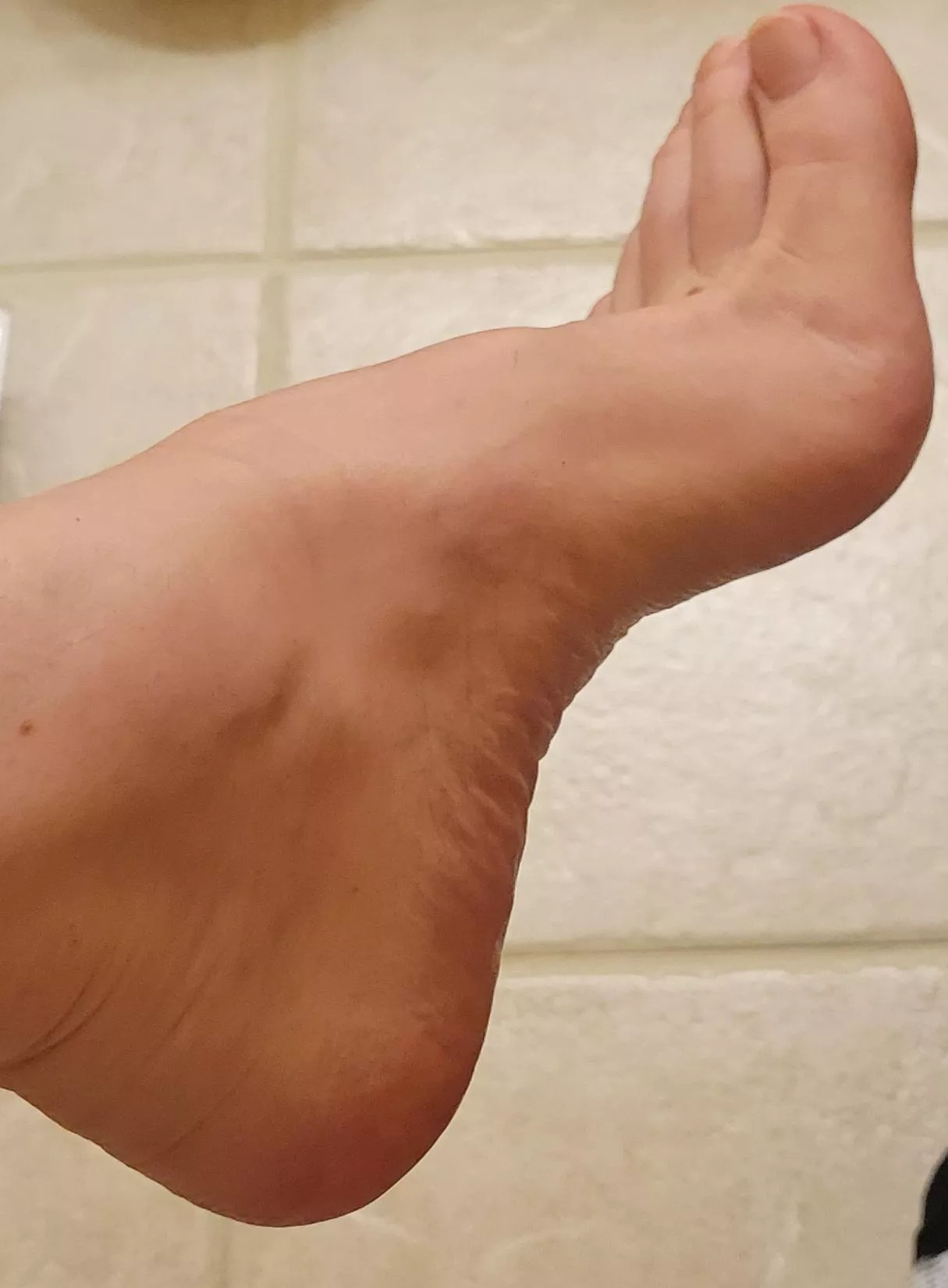 Legs crossed, my left foot... would I catch you staring?