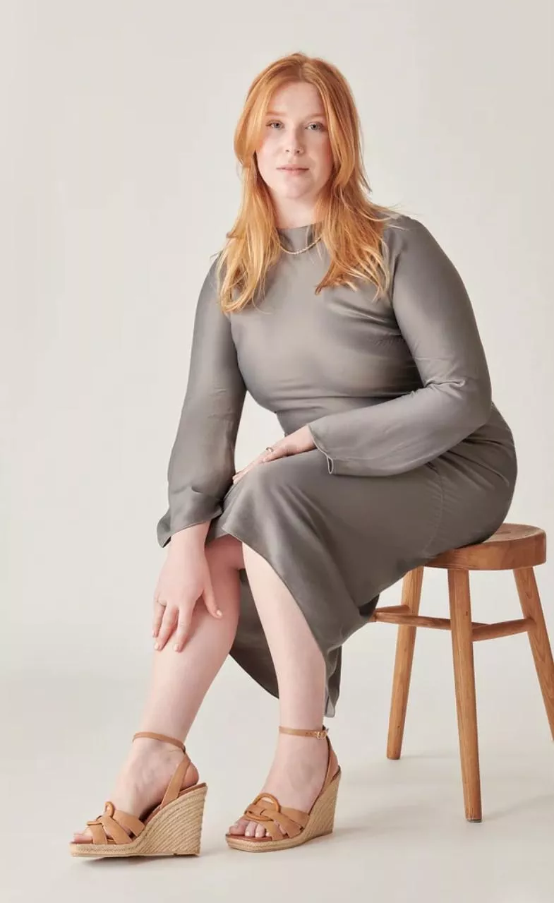 Curvy red head in grey dress