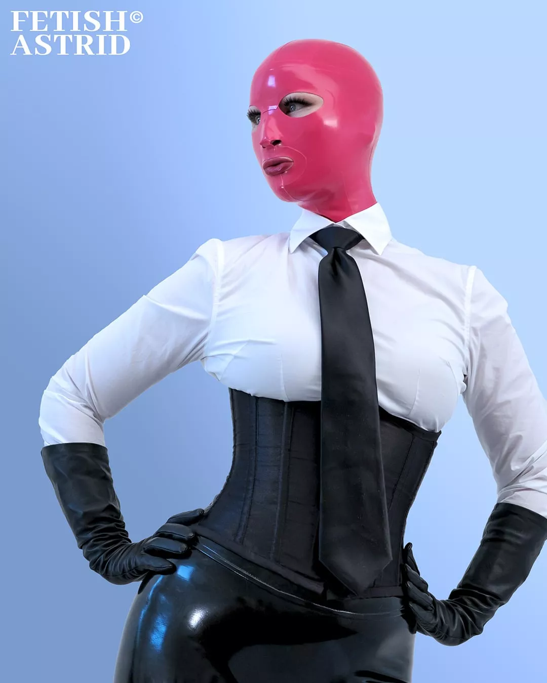 Latex hood, white shirt and black tie with a corset and leather gloves 👁🫦👁