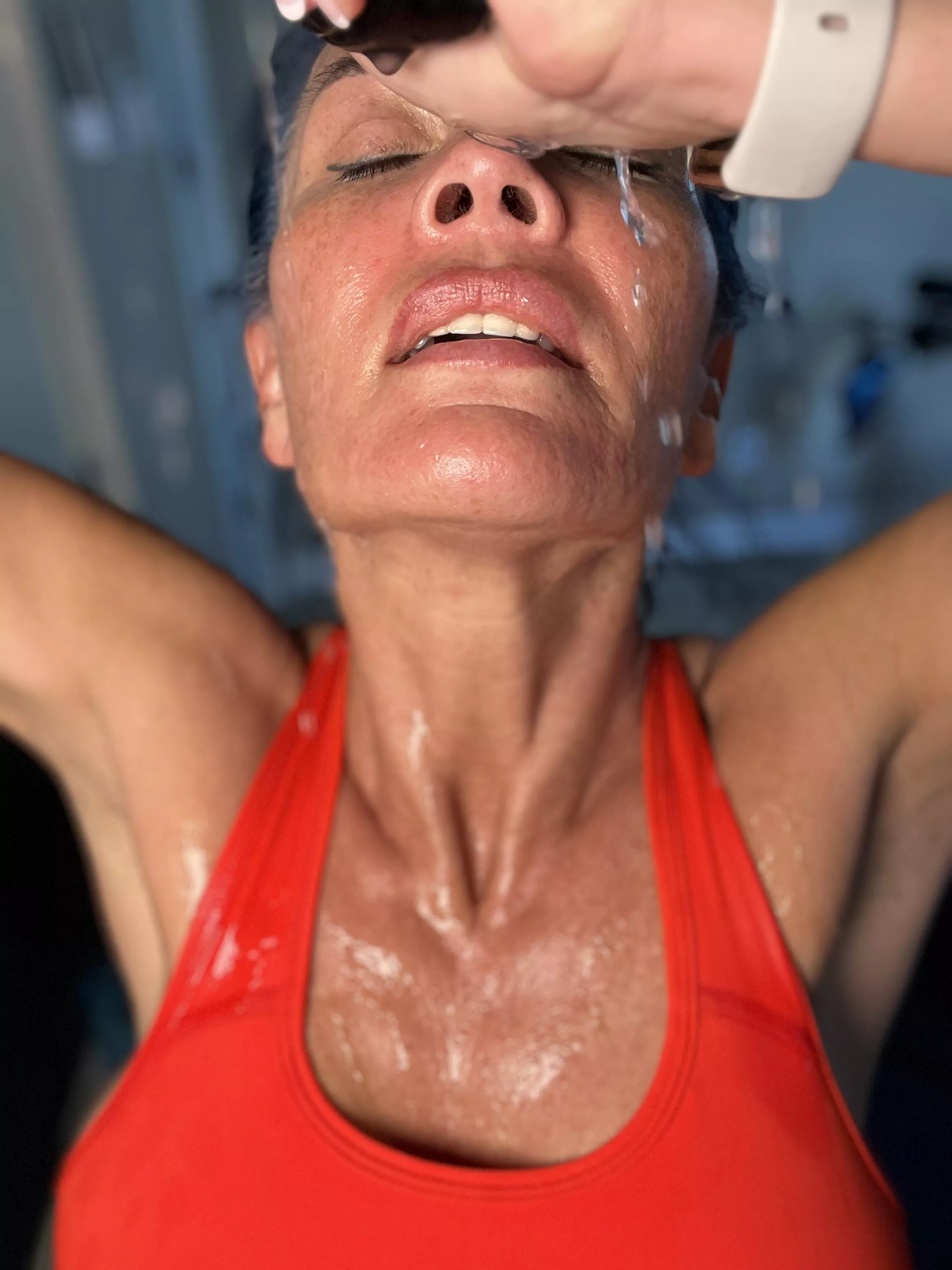 Wringing out the sweat. My eyes look like cherry tomatoes from the sweat dripping into them