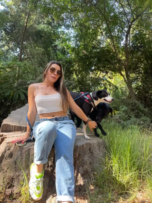 Strolling through nature with my furry besties, rocking my crop top and jeans combo