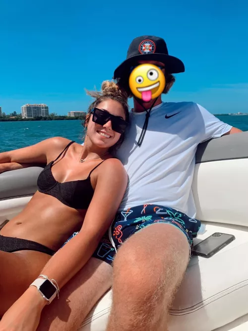 Black bikini with shades on a boat