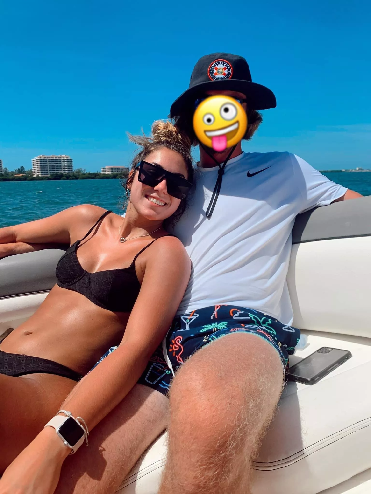 Black bikini with shades on a boat