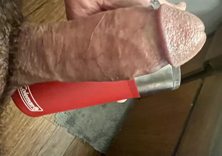 Against my coleman insulated coffee cup. Keeps hot things hot ;)