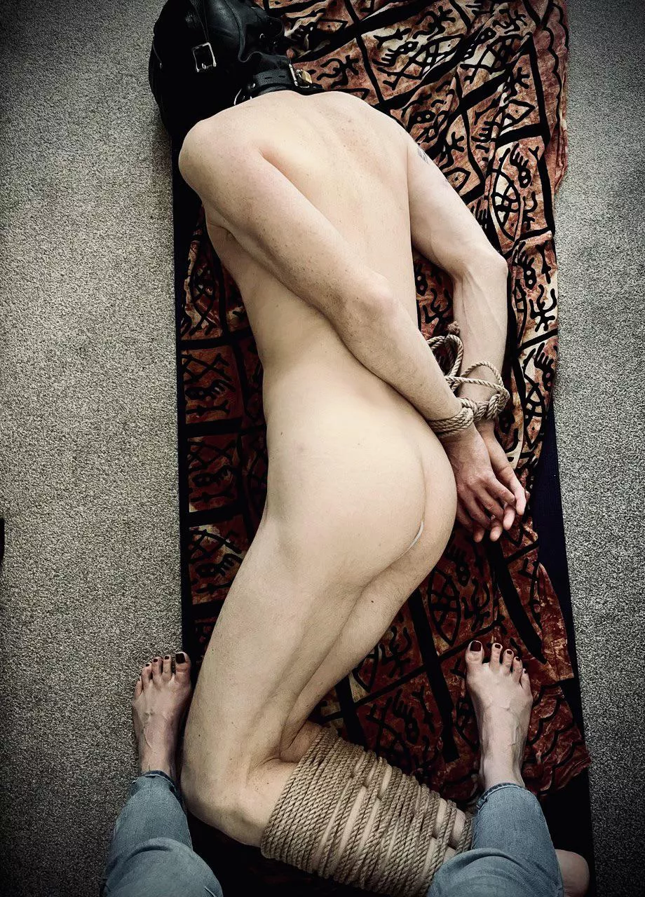 I spent about three hours like this yesterday afternoon. Locked into my deprivation hood, legs and wrists tied, and with an Aneros toy in my ass. Completely helpless while my Lady sat on the sofa next to me, drank Prosecco and relaxed.