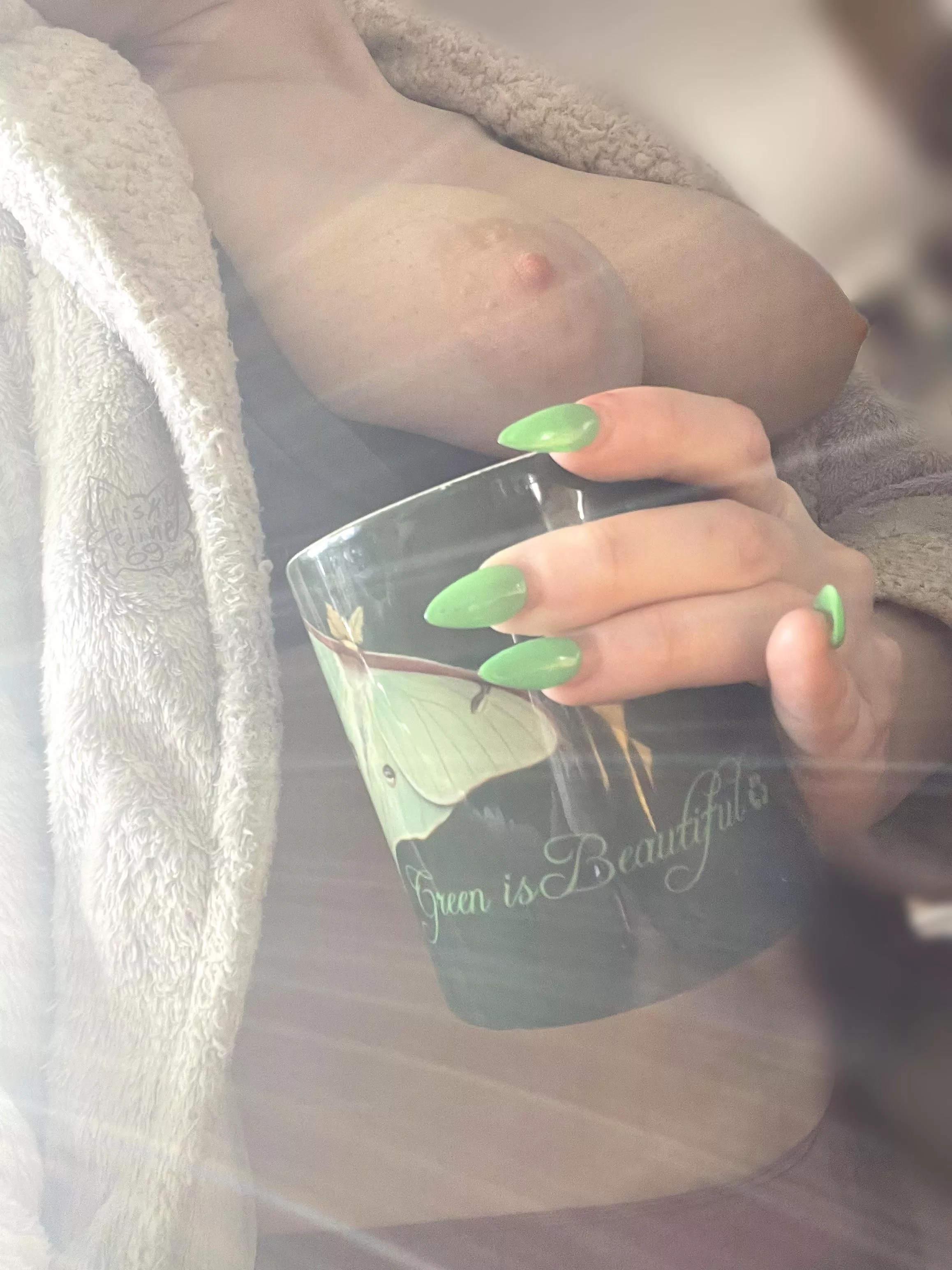 “Green is Beautiful” mug with a luna moth on it 💚 ft my green nails! (and also featuring my tits)