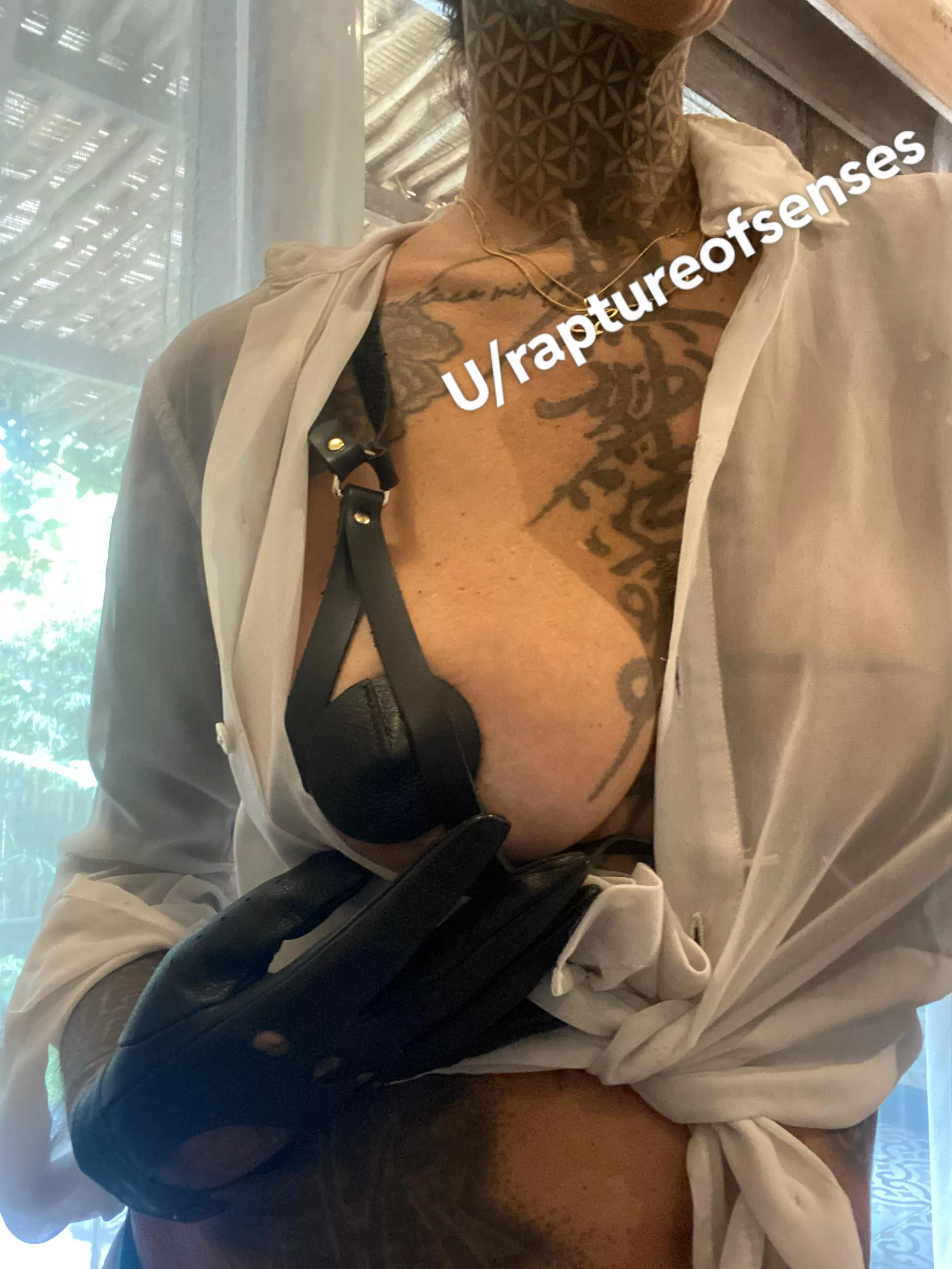 Putting an outfit together for tonight. Leather bra and leather gloves