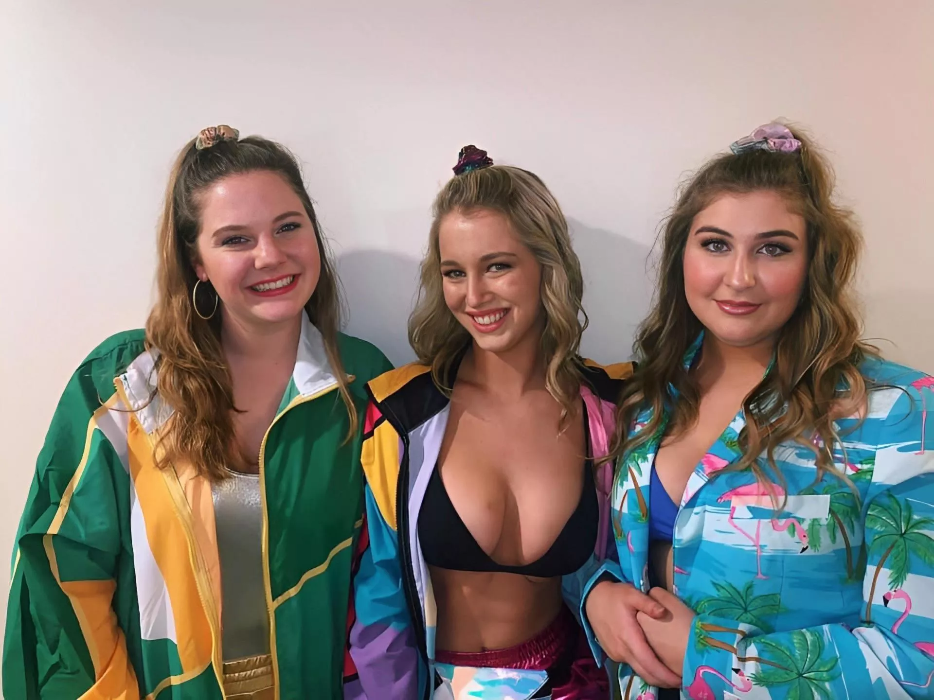 Right is pissed, left is faking a smile, knowing their BFs have been staring at their blonde friend all night