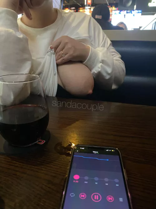 Stranger controlling my vibrator while I flash my tits at the local bar
