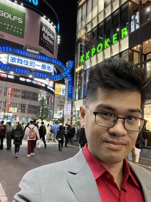 Attempting my awkward Kiryu selfie at the Kabukicho sign. (The sign is temporarily blue, due to a special event.)