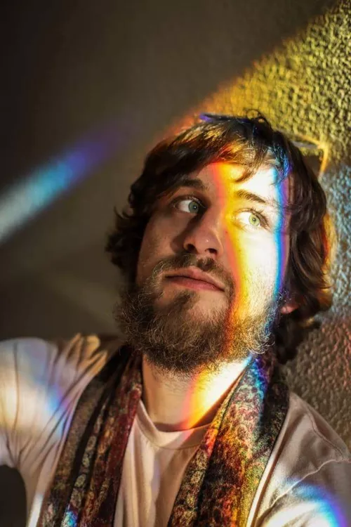 Basking in a rainbow sunbeam shining through a prism. Feeling cute 😊