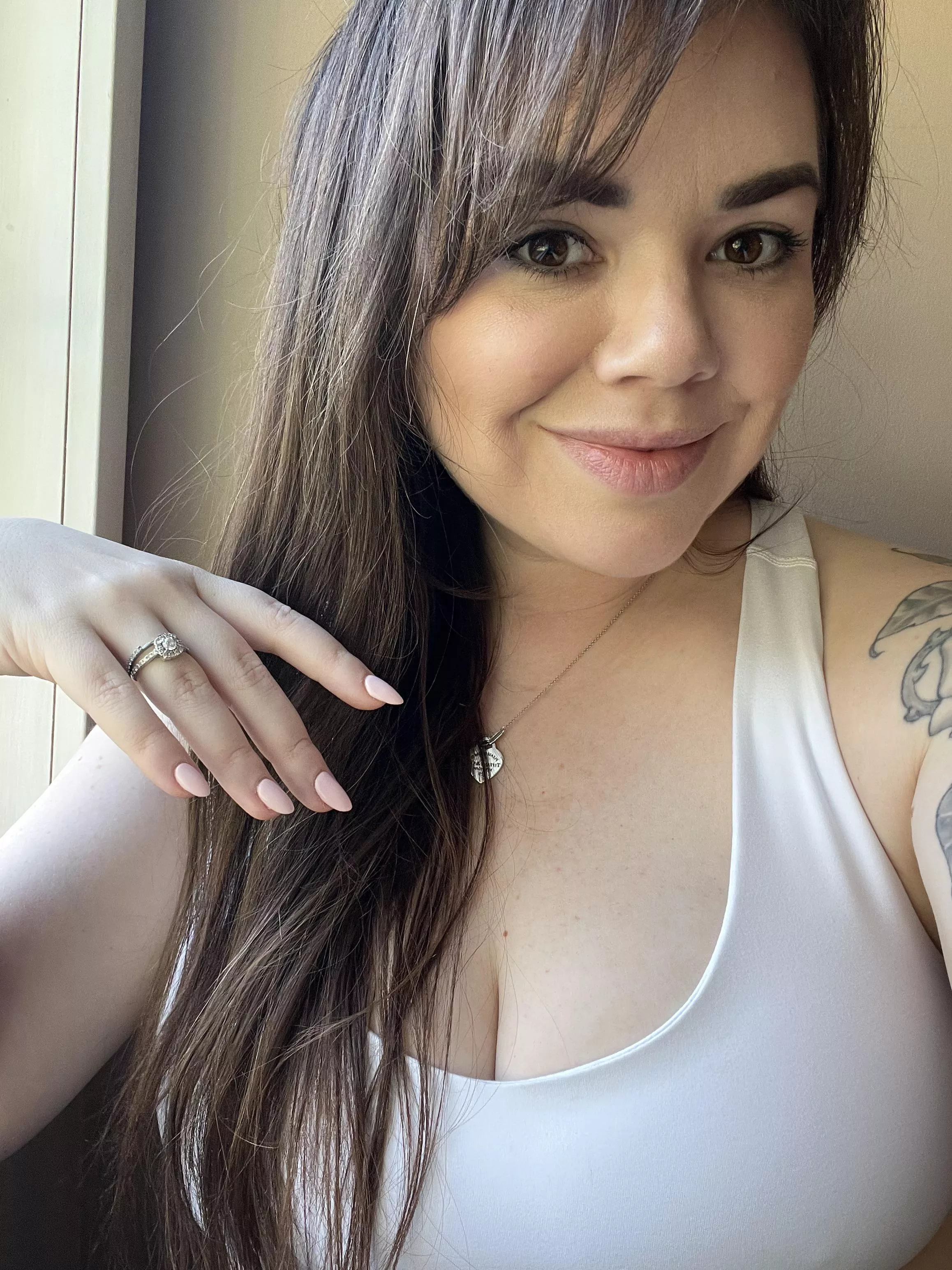 A little cleavage and pink polish…