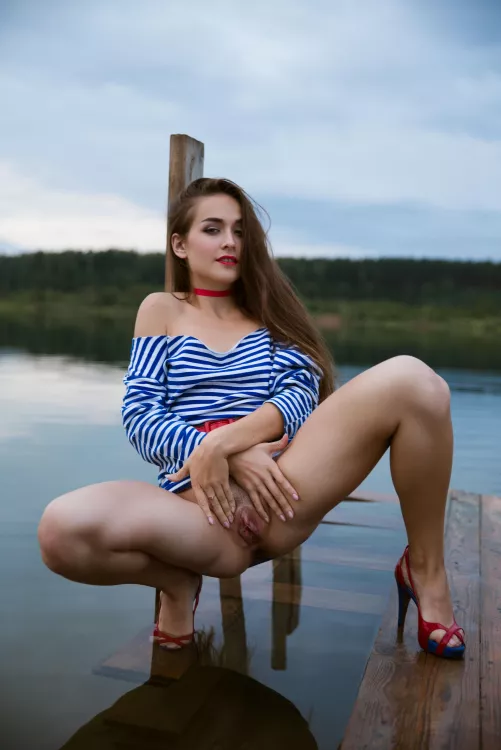 spread her legs and labia by the water