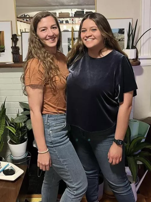 She’s wearing a loose top but it’s still enough to shame her friend with the tight clothes