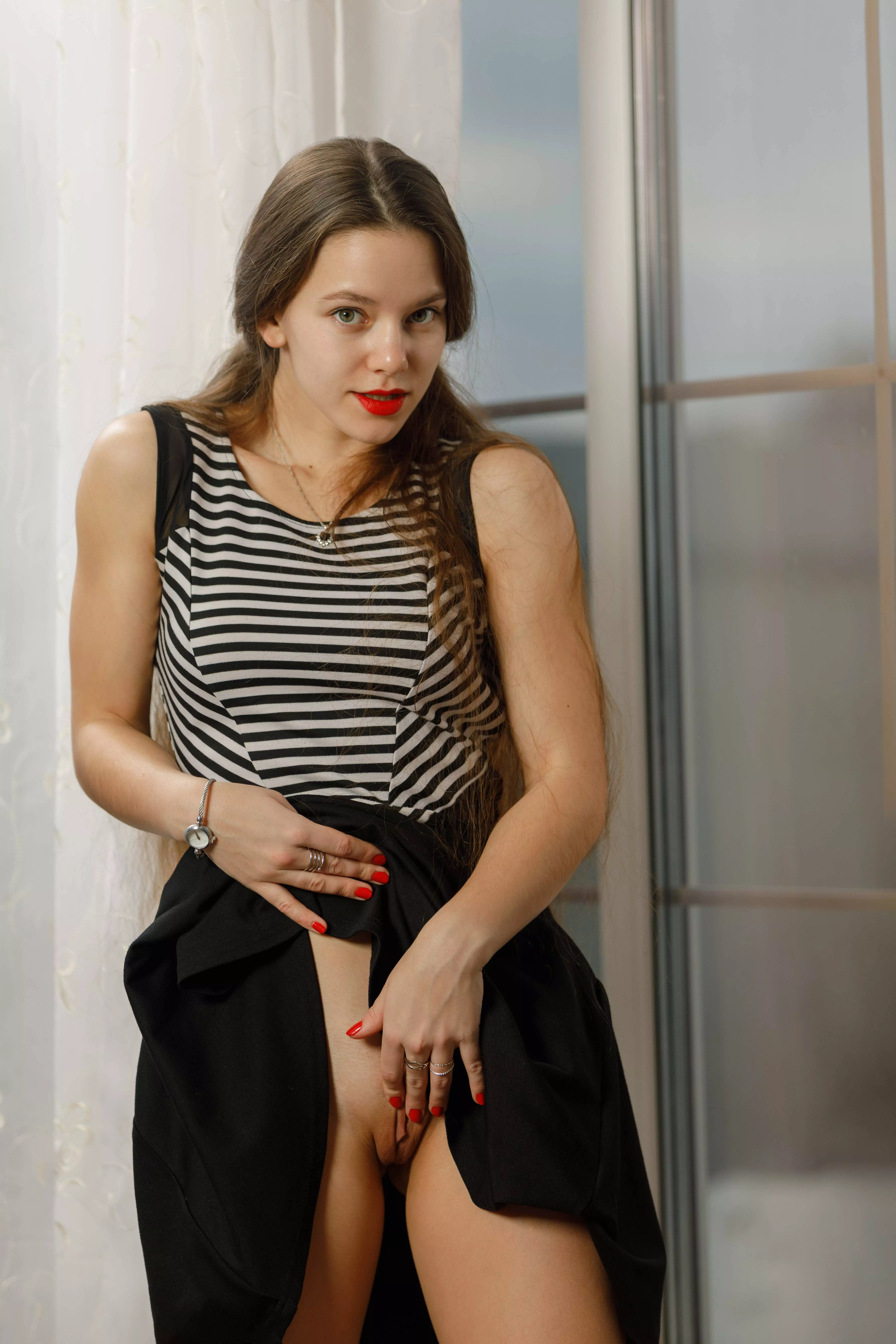 lifted her skirt to show pussy